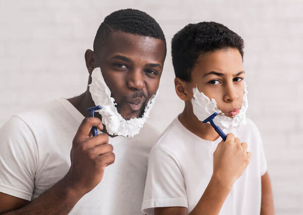 two boys shaving face