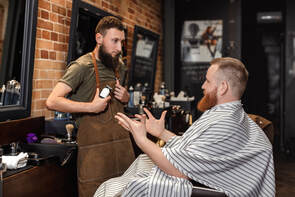 Man talking to barber