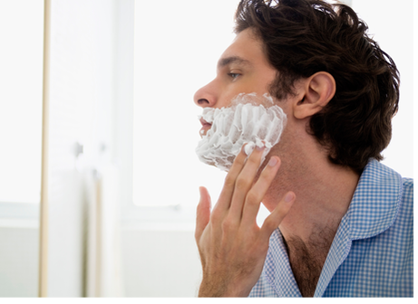 man applying shaving cream