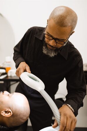barber giving hydrosteam facial