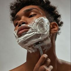 Man shaving neck